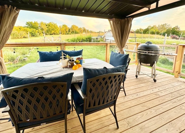 deck featuring area for grilling and a rural view