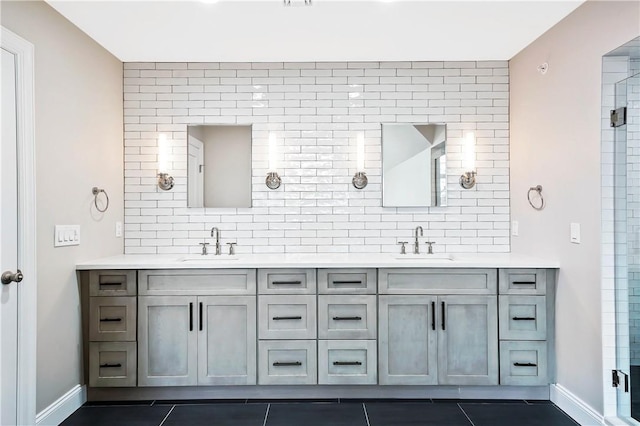 full bath with double vanity, decorative backsplash, and a sink