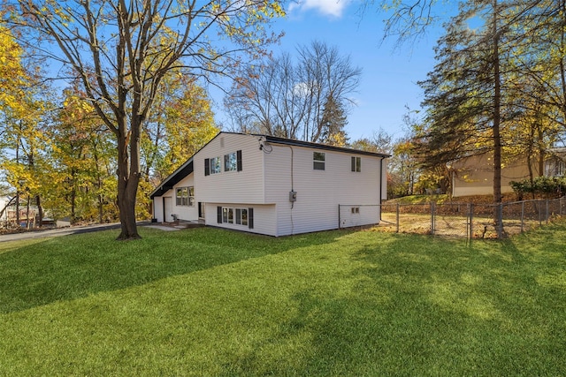 view of property exterior with a yard