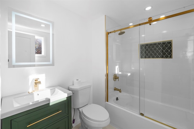 full bathroom with vanity, toilet, and combined bath / shower with glass door