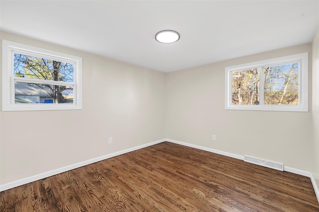 empty room with wood-type flooring