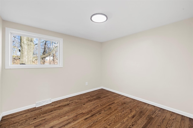 unfurnished room featuring hardwood / wood-style flooring