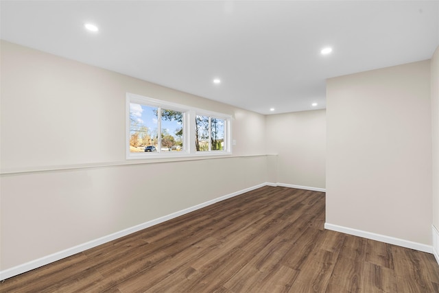 basement featuring dark hardwood / wood-style floors