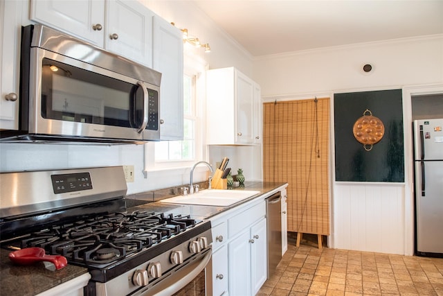 kitchen featuring white cabinetry, sink, crown molding, and appliances with stainless steel finishes