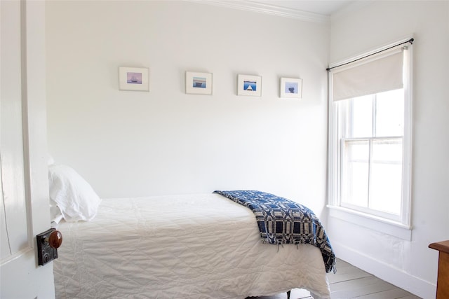 bedroom with ornamental molding