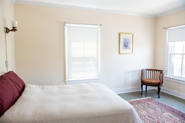 bedroom with dark hardwood / wood-style floors and crown molding