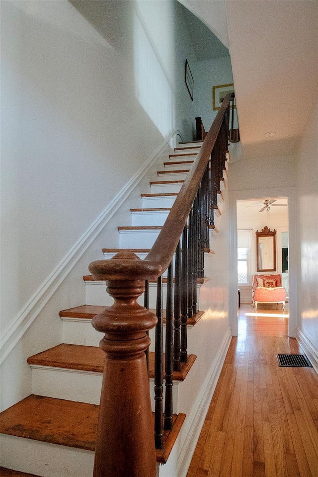 stairway featuring hardwood / wood-style flooring