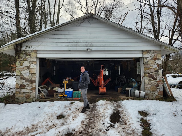 view of snow covered garage