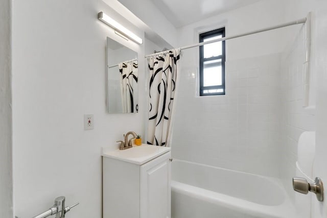 bathroom featuring shower / tub combo with curtain and vanity