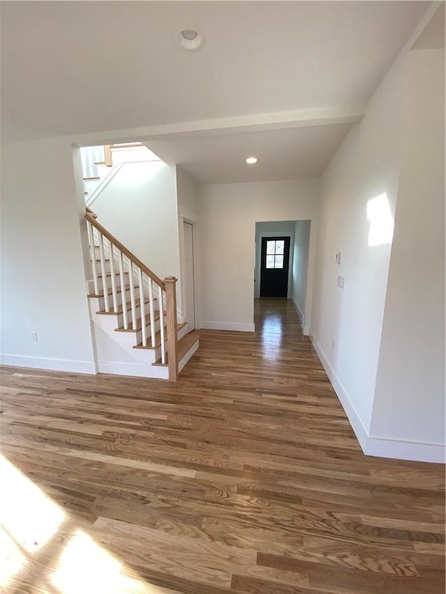 foyer entrance with hardwood / wood-style flooring