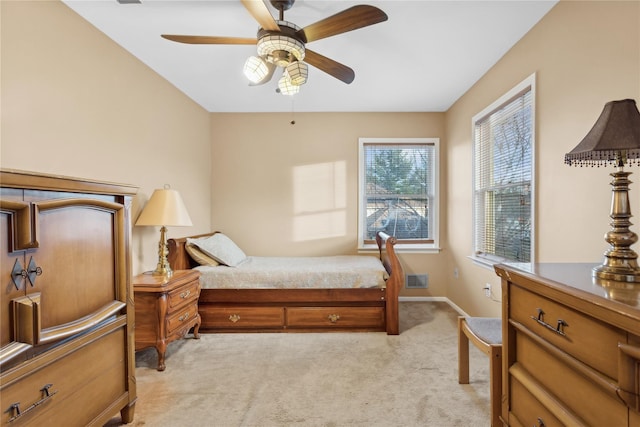 bedroom featuring ceiling fan and light colored carpet