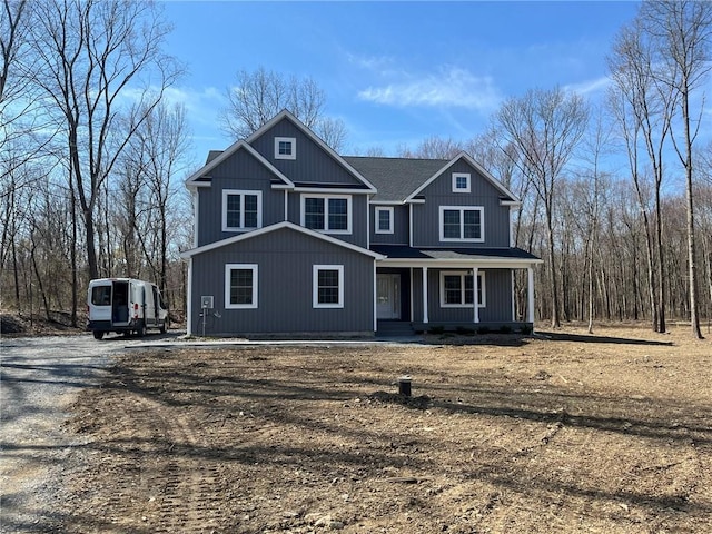 craftsman house with covered porch and driveway