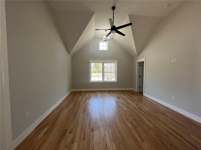 additional living space with light hardwood / wood-style floors, ceiling fan, and lofted ceiling