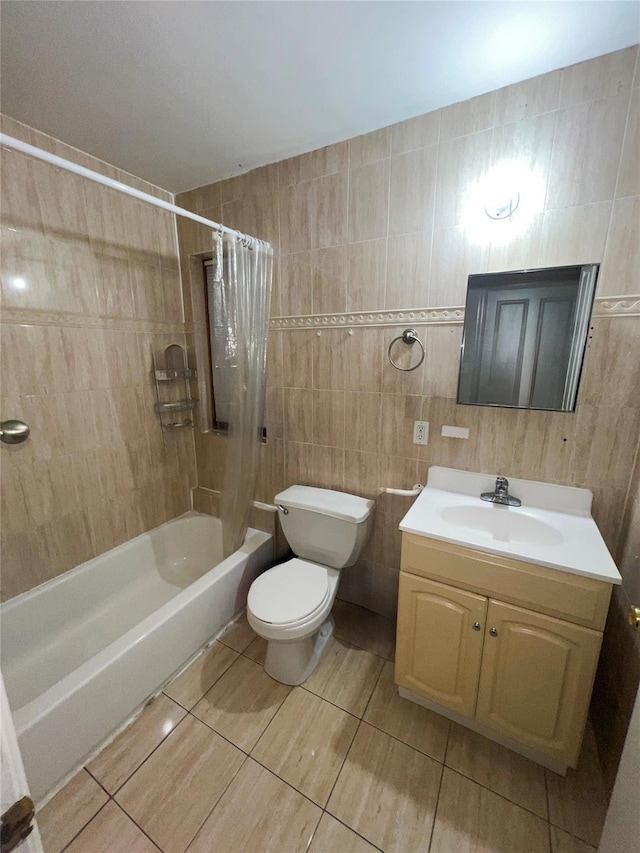 full bath with shower / tub combo with curtain, tile walls, vanity, and toilet