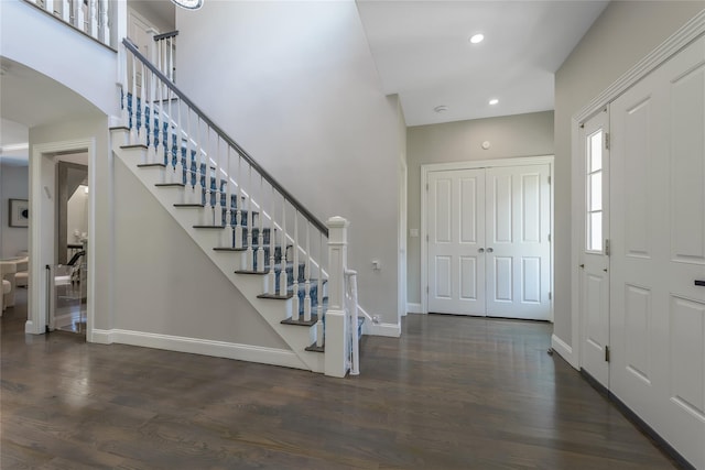 entrance foyer with dark hardwood / wood-style flooring