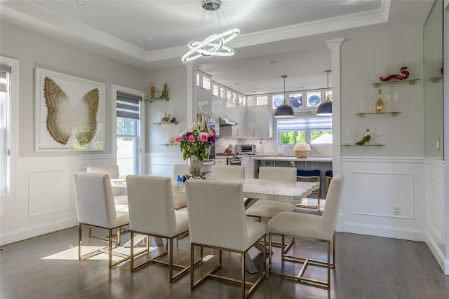 dining area featuring a wealth of natural light, crown molding, and dark hardwood / wood-style floors