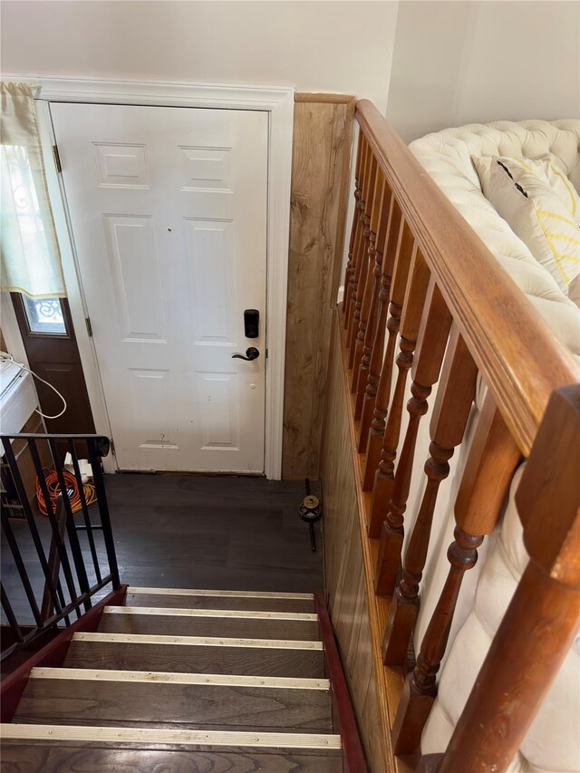 stairway featuring wood-type flooring