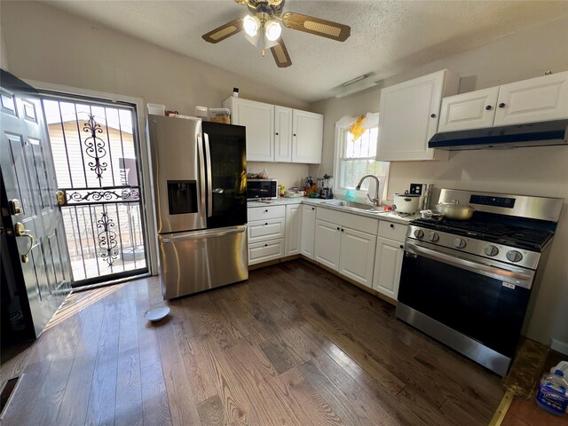 kitchen featuring sink, white cabinets, dark wood-type flooring, and appliances with stainless steel finishes