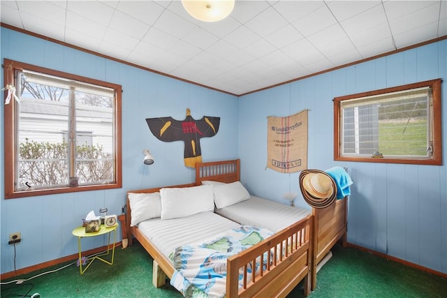 carpeted bedroom featuring crown molding