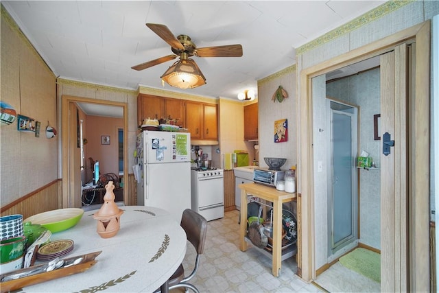 kitchen with white appliances and ceiling fan