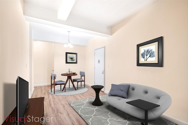 4380 Vireo Ave Unit L-15, Bronx, NY 10470 - sitting room with wood finished floors and beamed ceiling