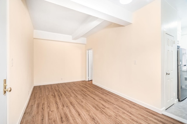 spare room with light hardwood / wood-style floors