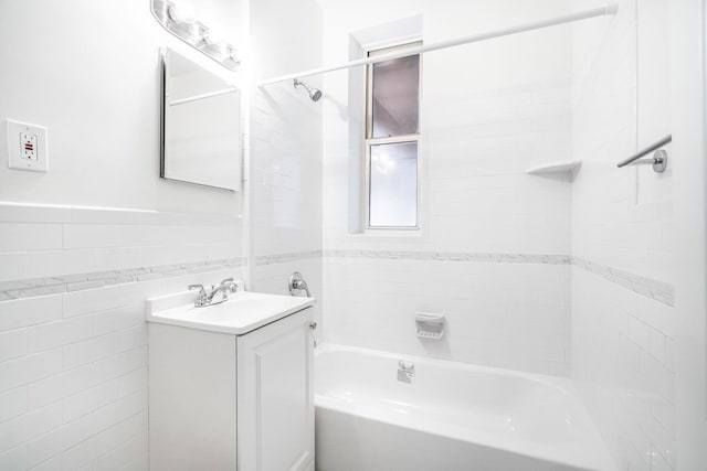 4380 Vireo Ave Unit L-15, Bronx, NY 10470 - full bath featuring vanity, shower / bathtub combination, tile walls, and a wainscoted wall