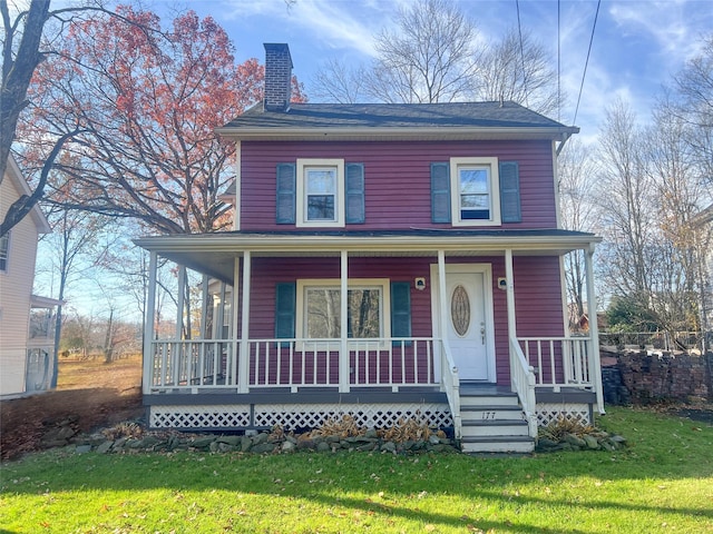 view of front of home featuring a porch and a front yard