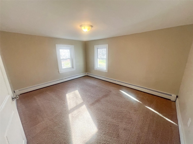 carpeted empty room with a baseboard radiator