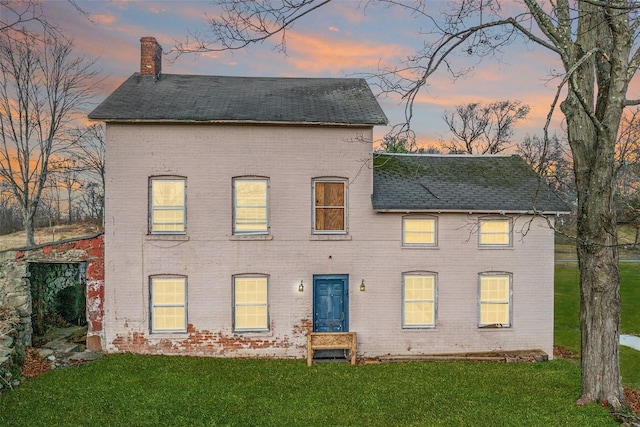 view of front of property with a yard