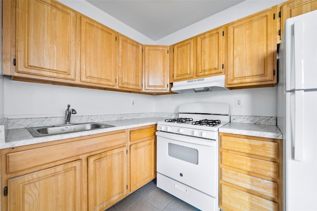 kitchen with light brown cabinetry, white appliances, sink, and light tile patterned floors