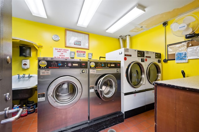 washroom featuring sink, tile patterned flooring, and independent washer and dryer