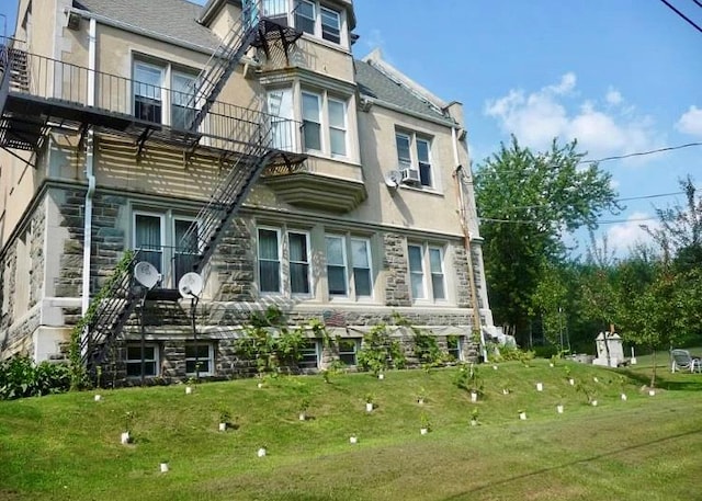 rear view of property with a yard