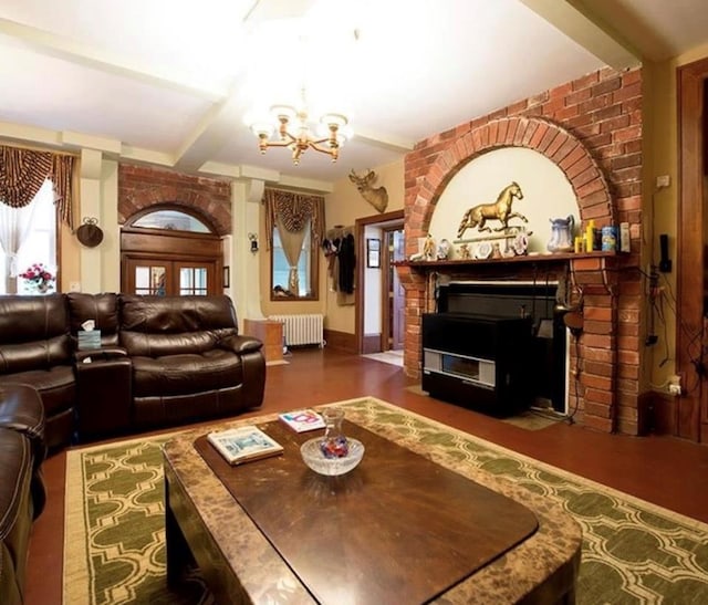 living room with radiator and a chandelier