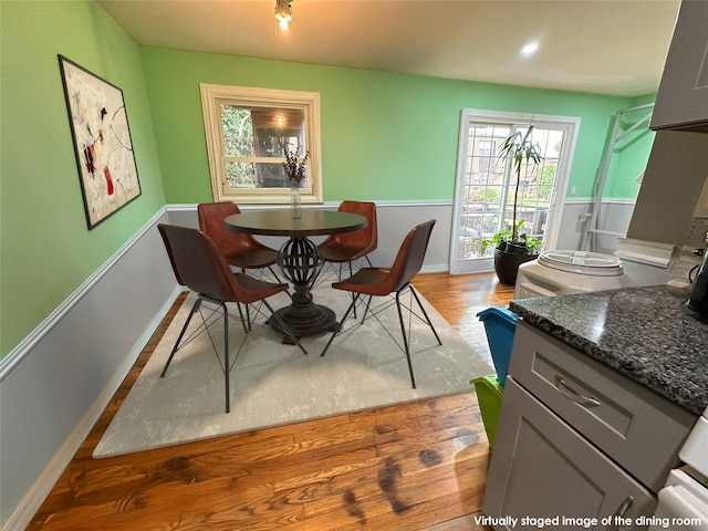 dining area with hardwood / wood-style flooring