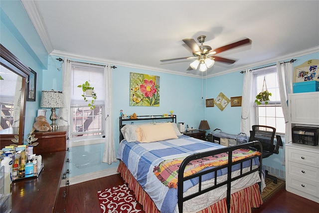 bedroom featuring ceiling fan, crown molding, and dark hardwood / wood-style floors