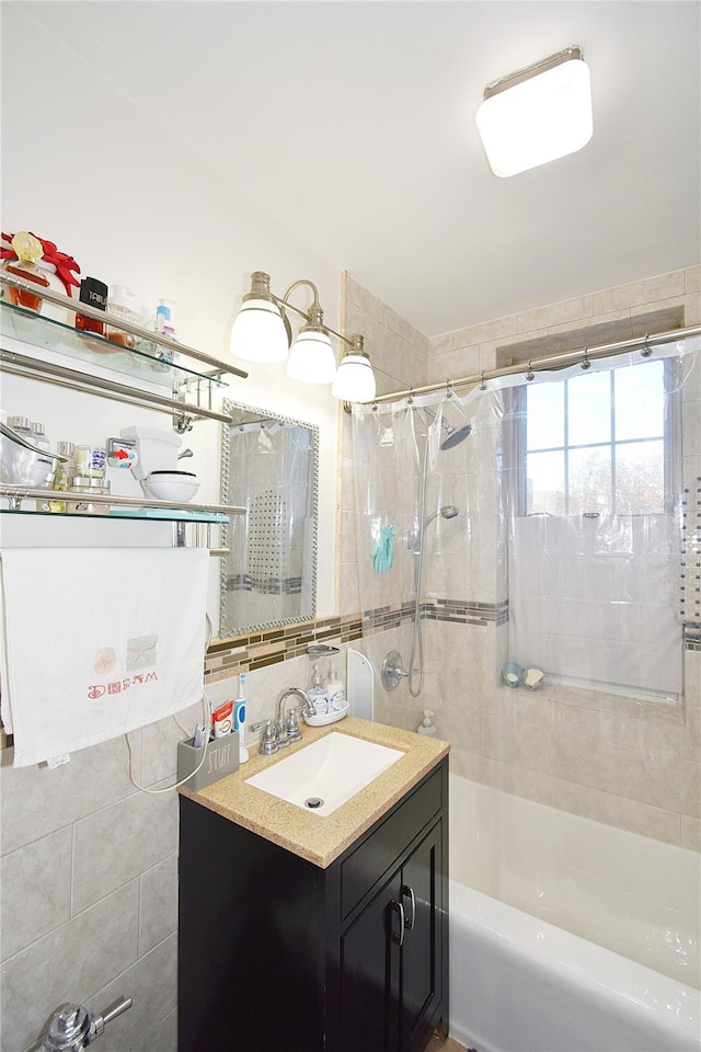 bathroom featuring vanity and shower / bath combination with curtain