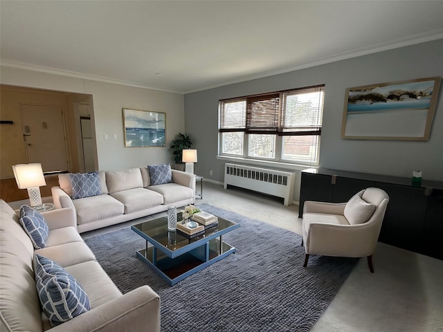 living room with radiator, crown molding, and carpet flooring