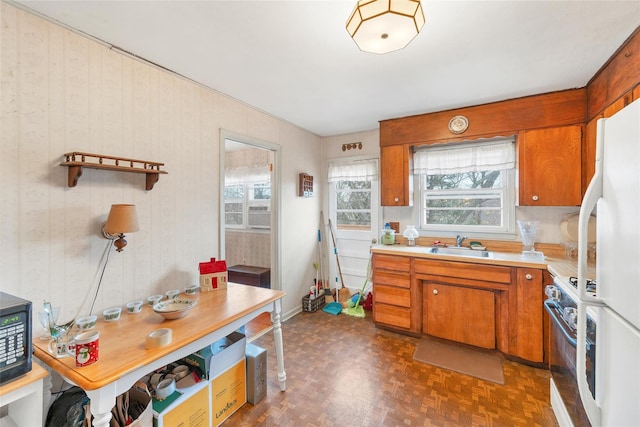 kitchen featuring white appliances and sink