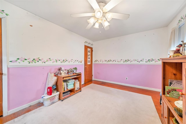 bedroom featuring hardwood / wood-style flooring and ceiling fan