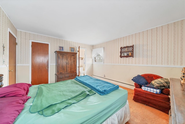 bedroom featuring carpet and a baseboard heating unit