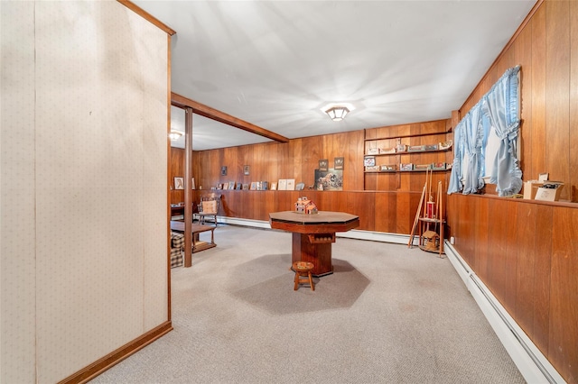 playroom featuring light colored carpet and a baseboard heating unit