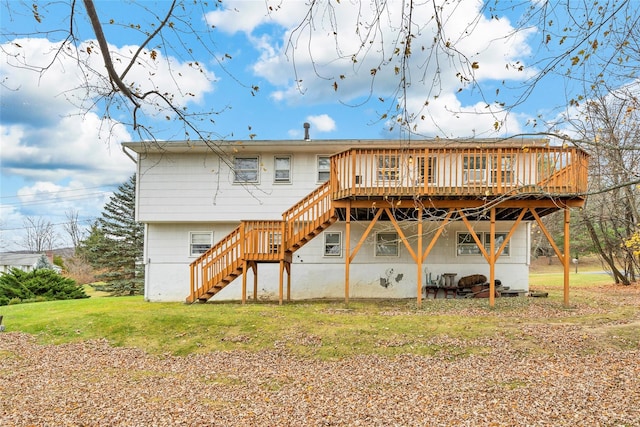 back of property with a deck and a lawn