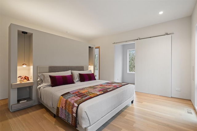 bedroom with light hardwood / wood-style flooring