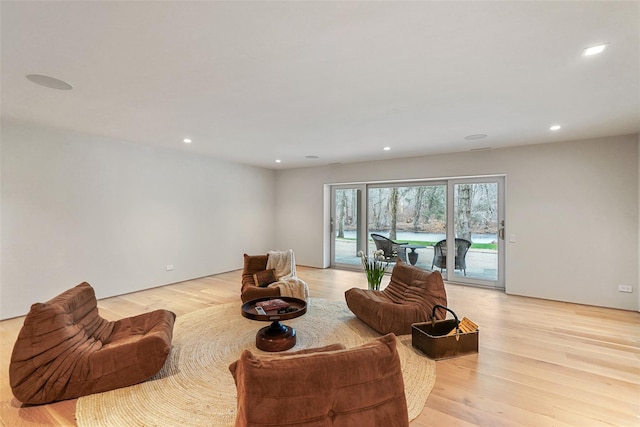 living room with light hardwood / wood-style floors