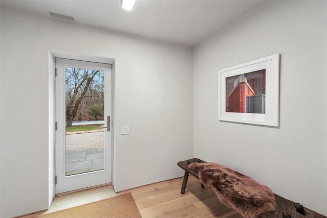 doorway with light hardwood / wood-style flooring