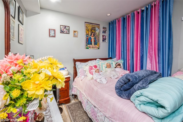 bedroom with wood-type flooring