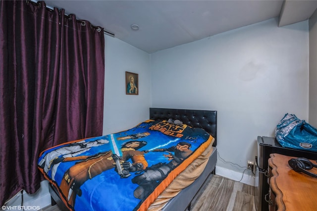 bedroom featuring hardwood / wood-style flooring