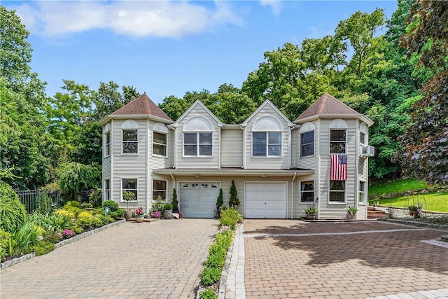 victorian-style house featuring a garage