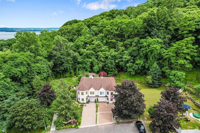 birds eye view of property with a water view